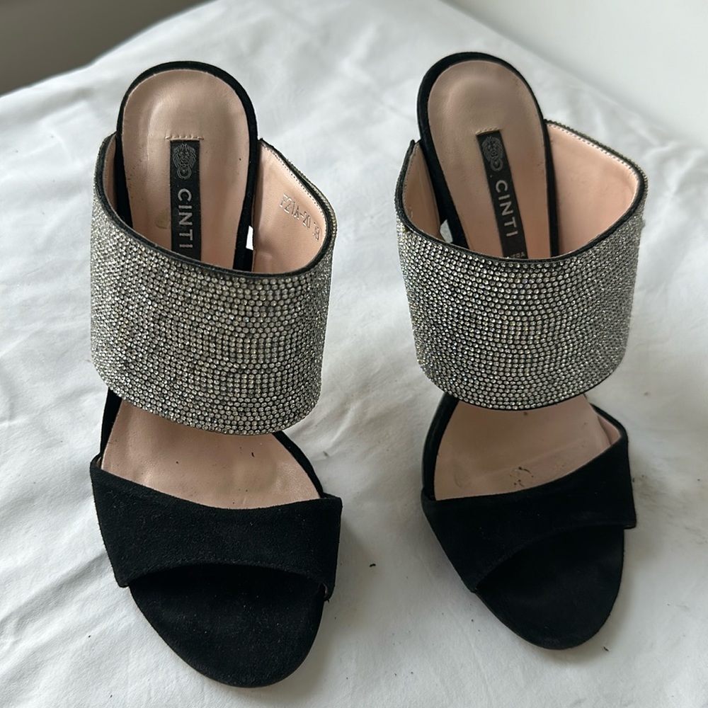 A pair of bling bling mules . Handmade in Italy .